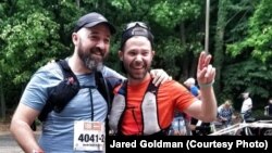 Jared with his friend after finishing ultra-marathon, 60 km run along the Berlin Wall