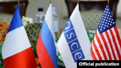 Armenia - Flags of the OSCE and the three nations co-chairing the OSCE's Minsk Group displayed during peace talks in Yerevan, 4Feb2014.