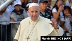 PANAMA- Pope Francis greets the faithful from the popemobile after arriving in Panama City for World Youth Day, on January 23, 2019.