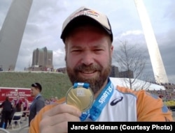 Jared after finishing half-marathon in St. Louis. It was his first run in the US and the first time his parents saw him run