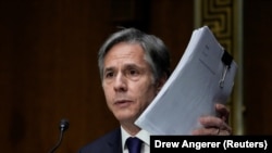 U.S. -- U.S. Secretary of State Antony Blinken holds up documents as he testifies during a Senate Foreign Relations Committee hearing to examine the United States withdrawal from Afghanistan, on Capitol Hill in Washington, September 14, 2021