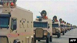 Bahrain -- A contingent of Gulf troops arrive in the unrest-wracked Kingdom of Bahrain across a causeway from Saudi Arabia, 14Mar2011